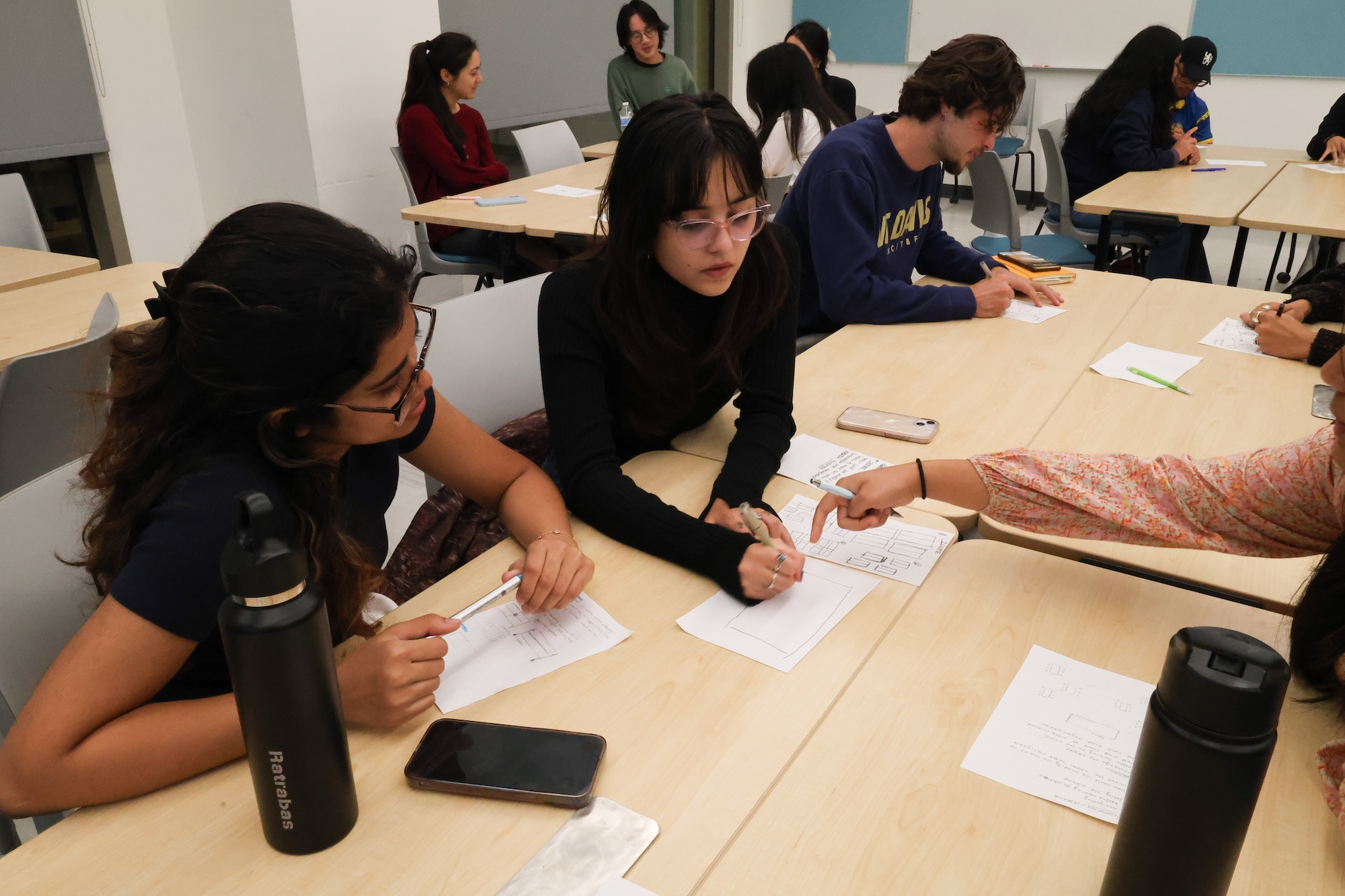 A group brainstorms together during a Fellowship team meeting