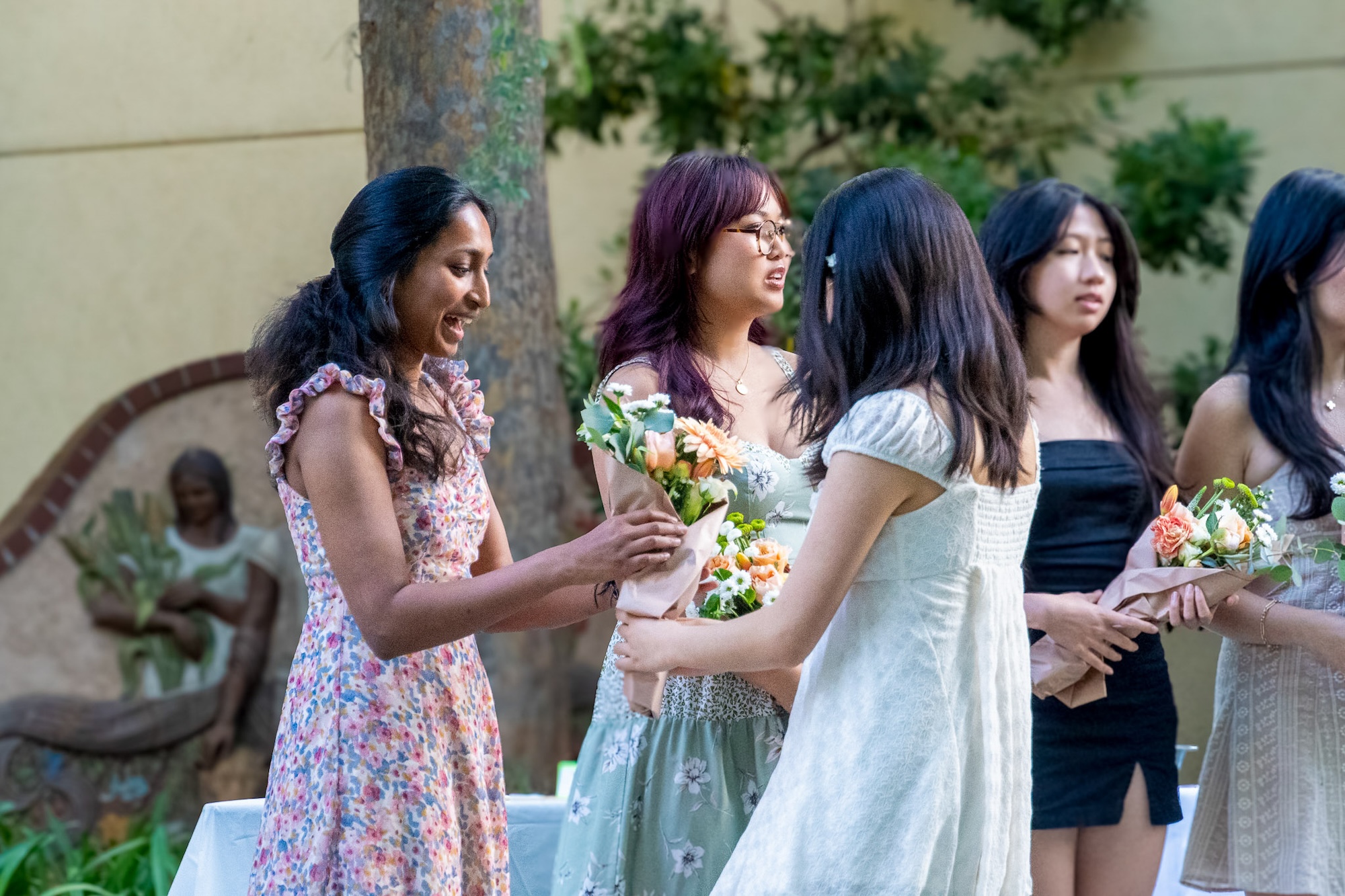 Last year's board receives flowers for their hard work